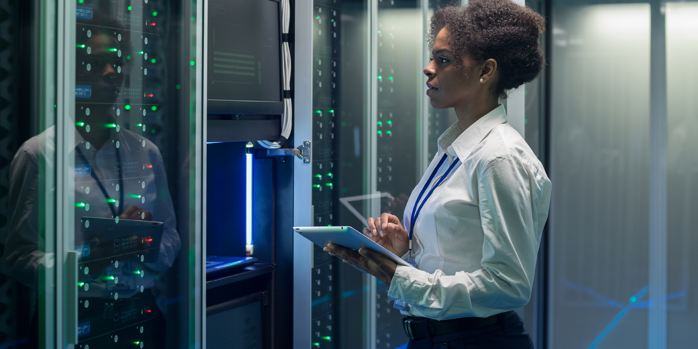 women standing outside of computer server room