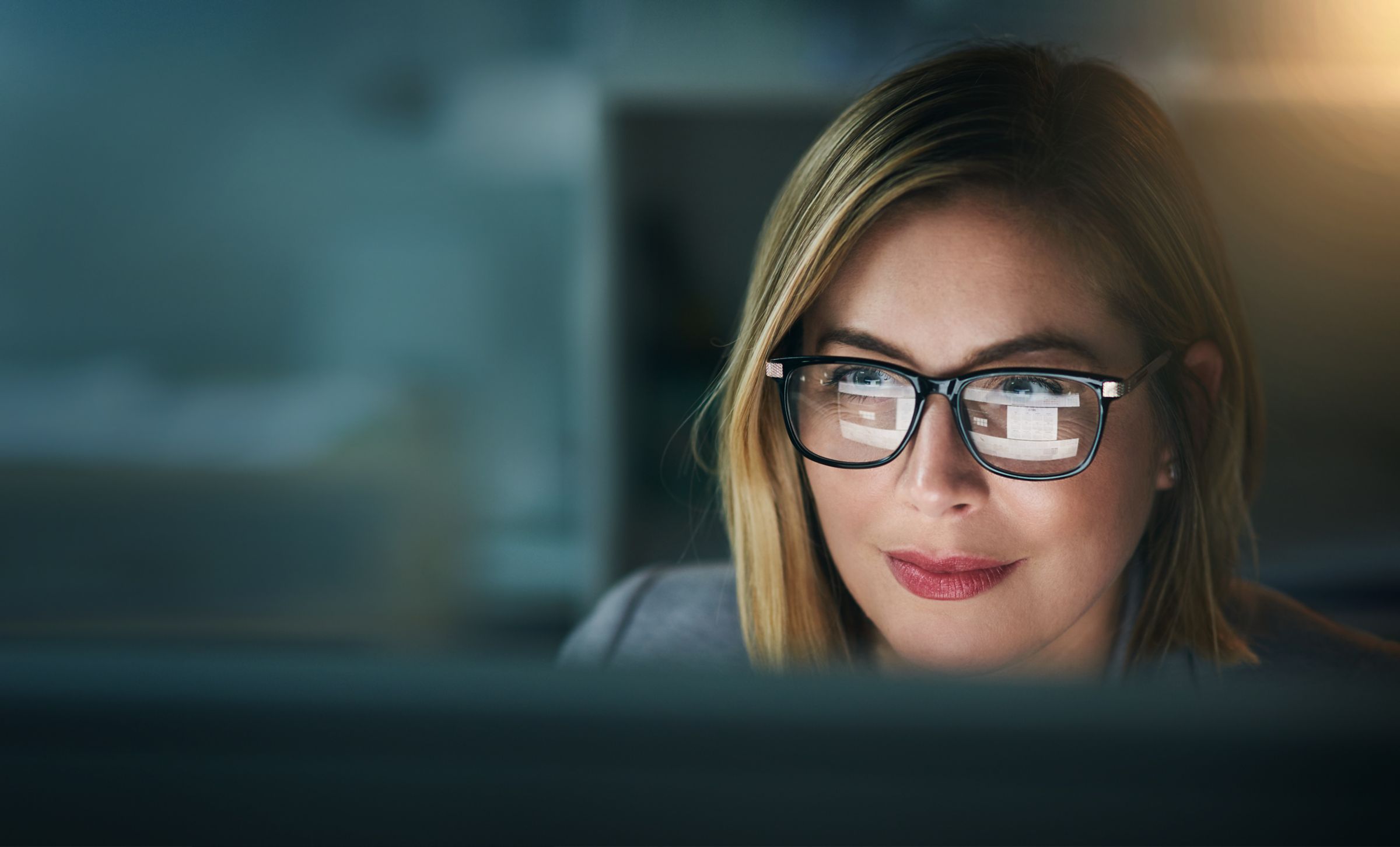 woman looking at a computer screen