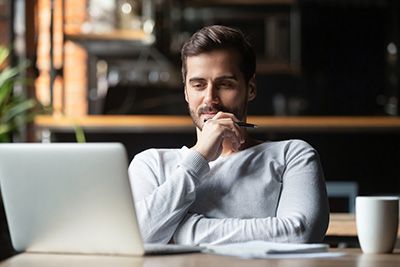 man looking at a computer