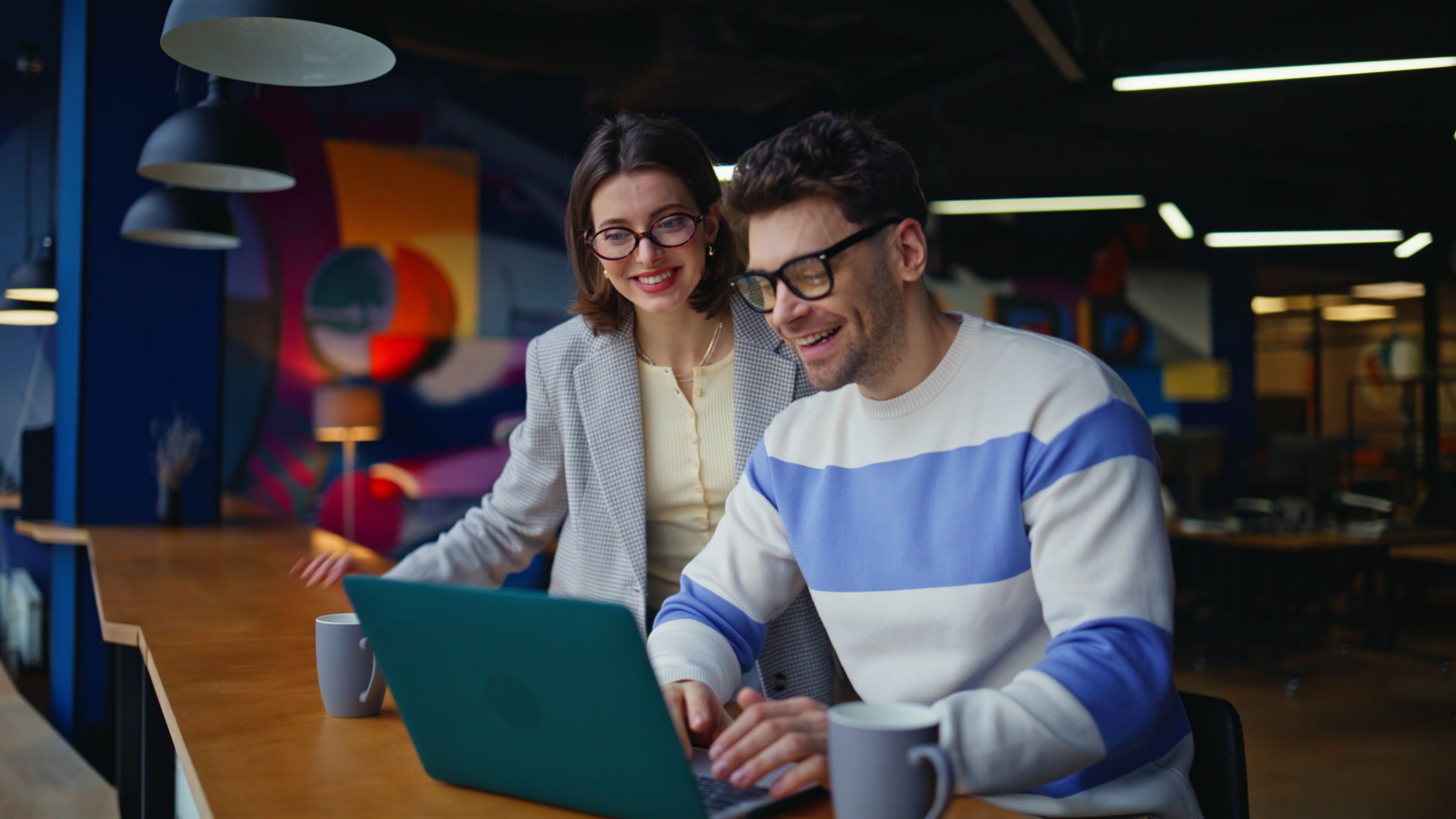 couple using on laptop