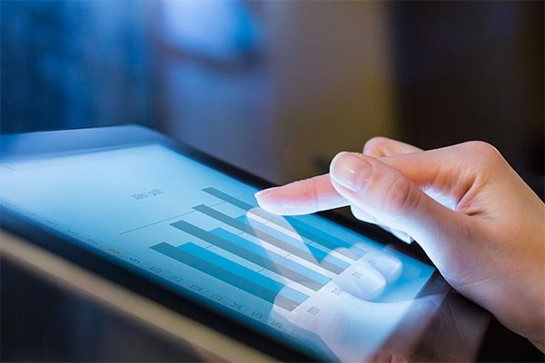 finger touching tablet