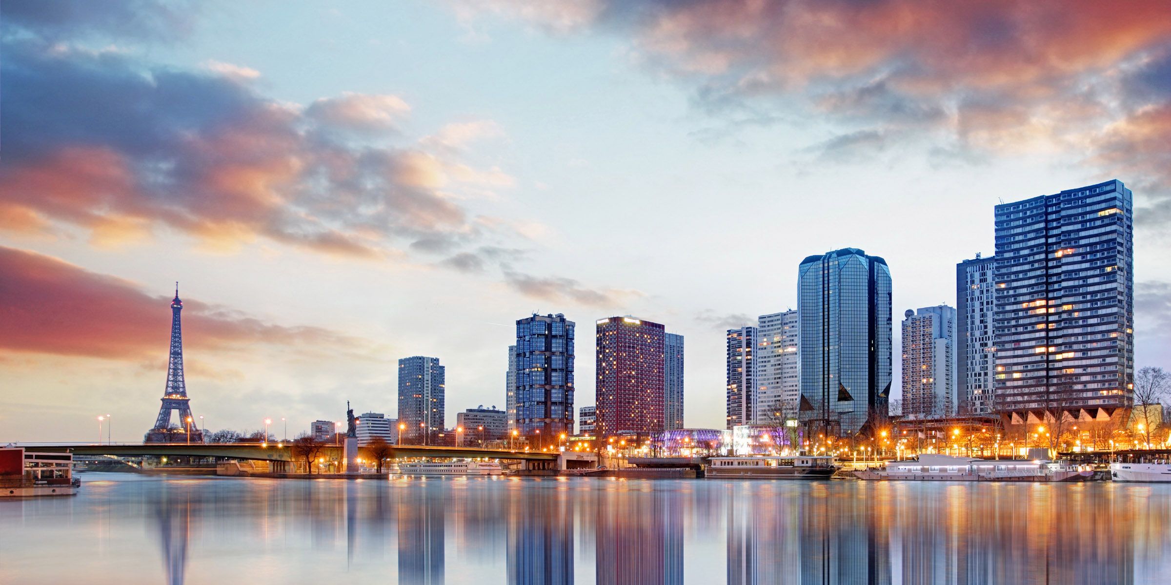 a french city skyline with a body of water