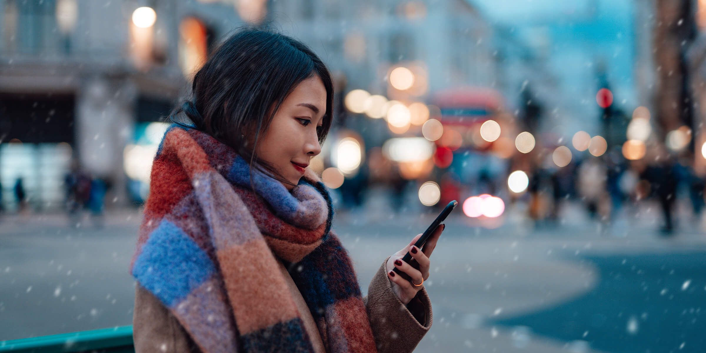 woman using laptop holding credit card