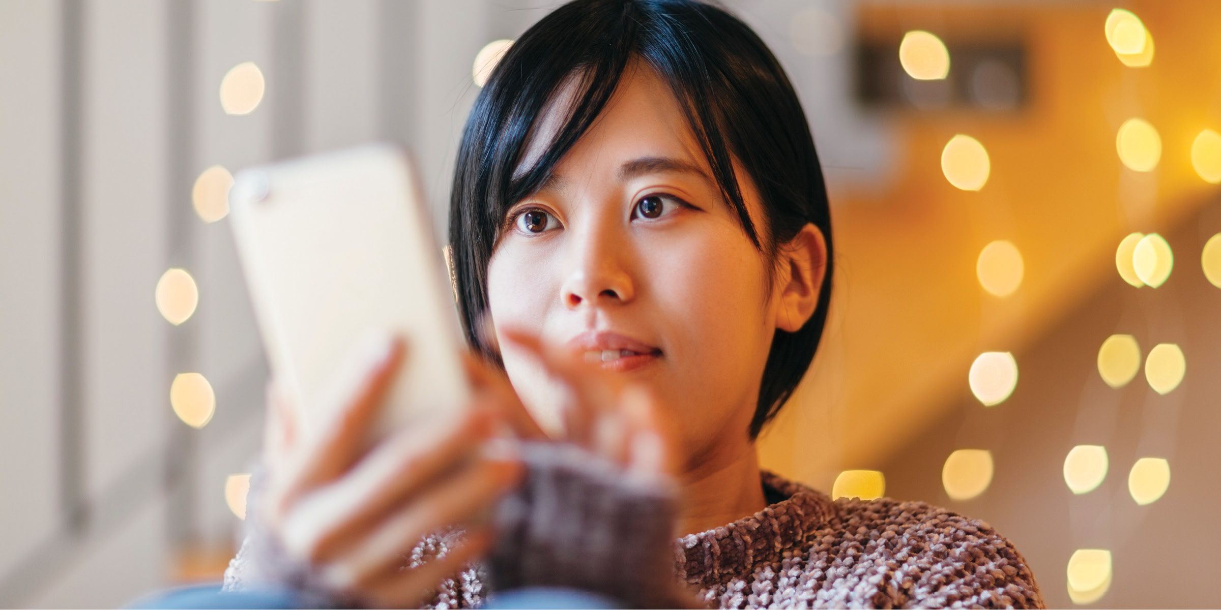 woman looking at phone