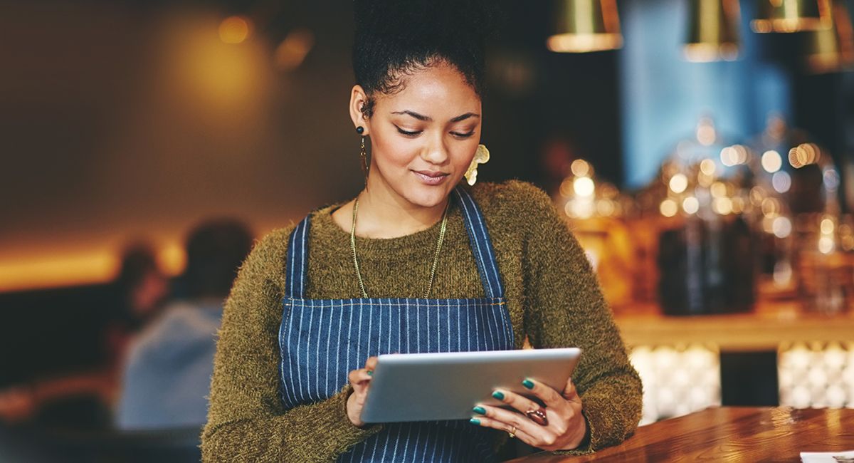 Small business owner using a tablet computer.