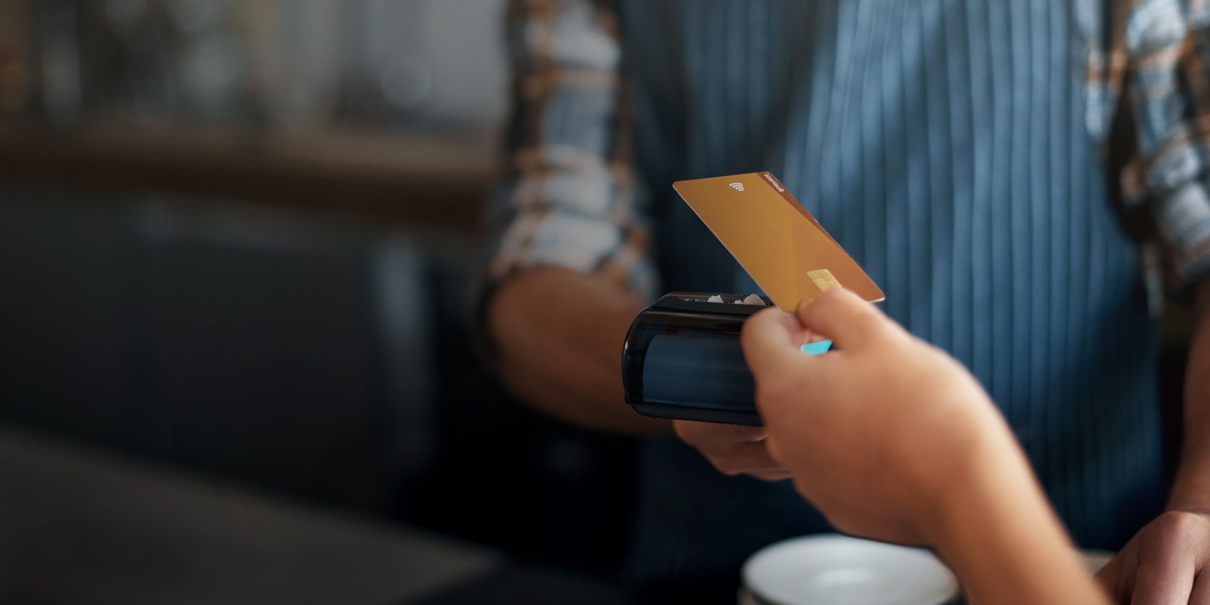 a person paying with an electronic card