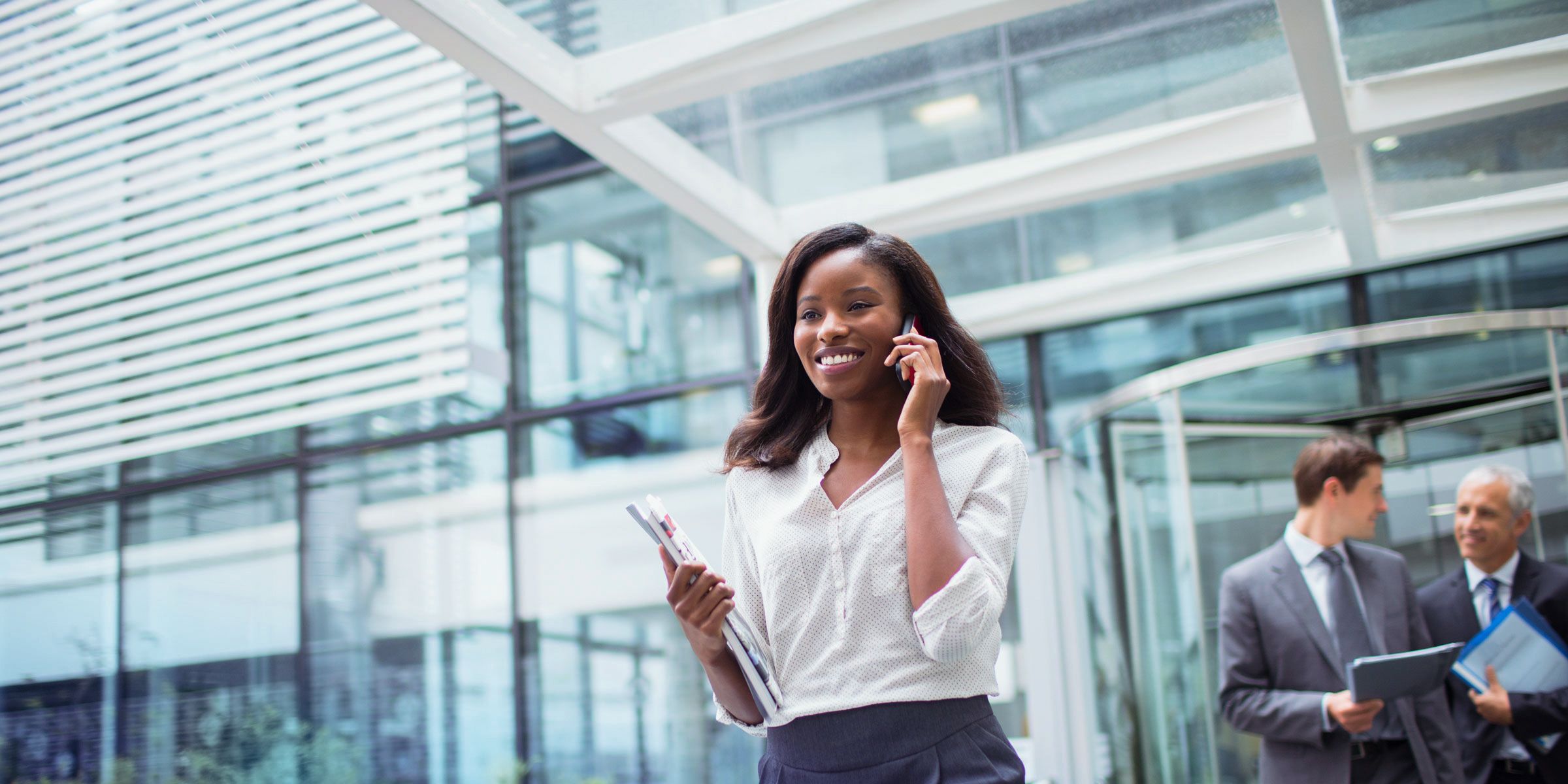 woman in office talking on phone