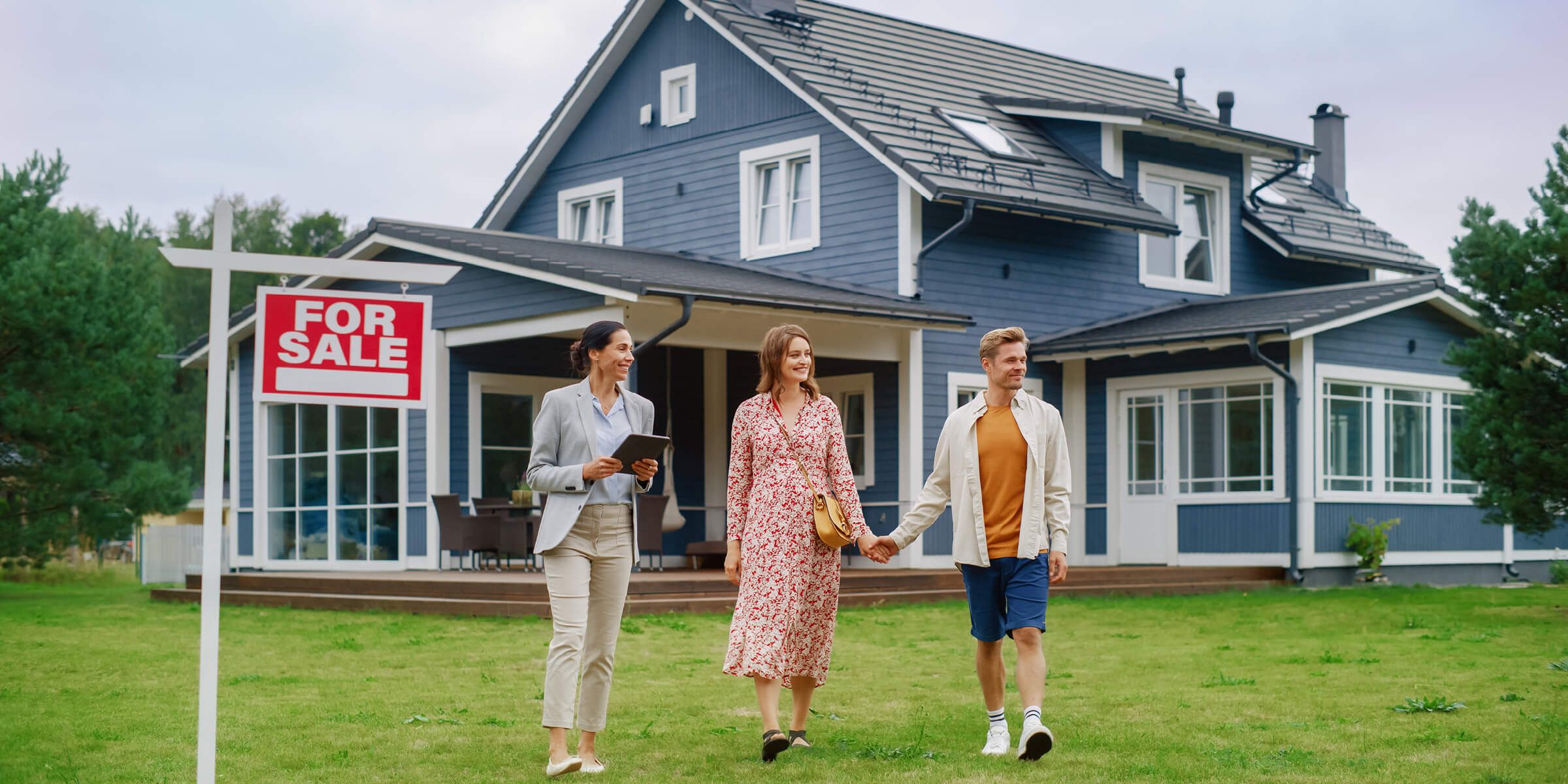 Young couple visiting homes for sale.