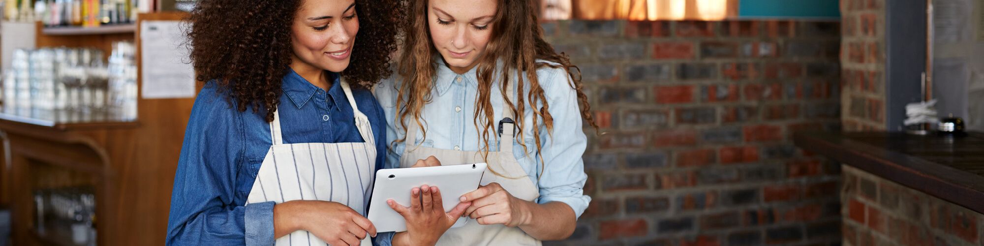 Fiserv small business owners with tablet