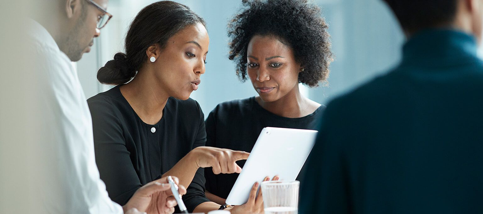 Businesswomen using tablet computer