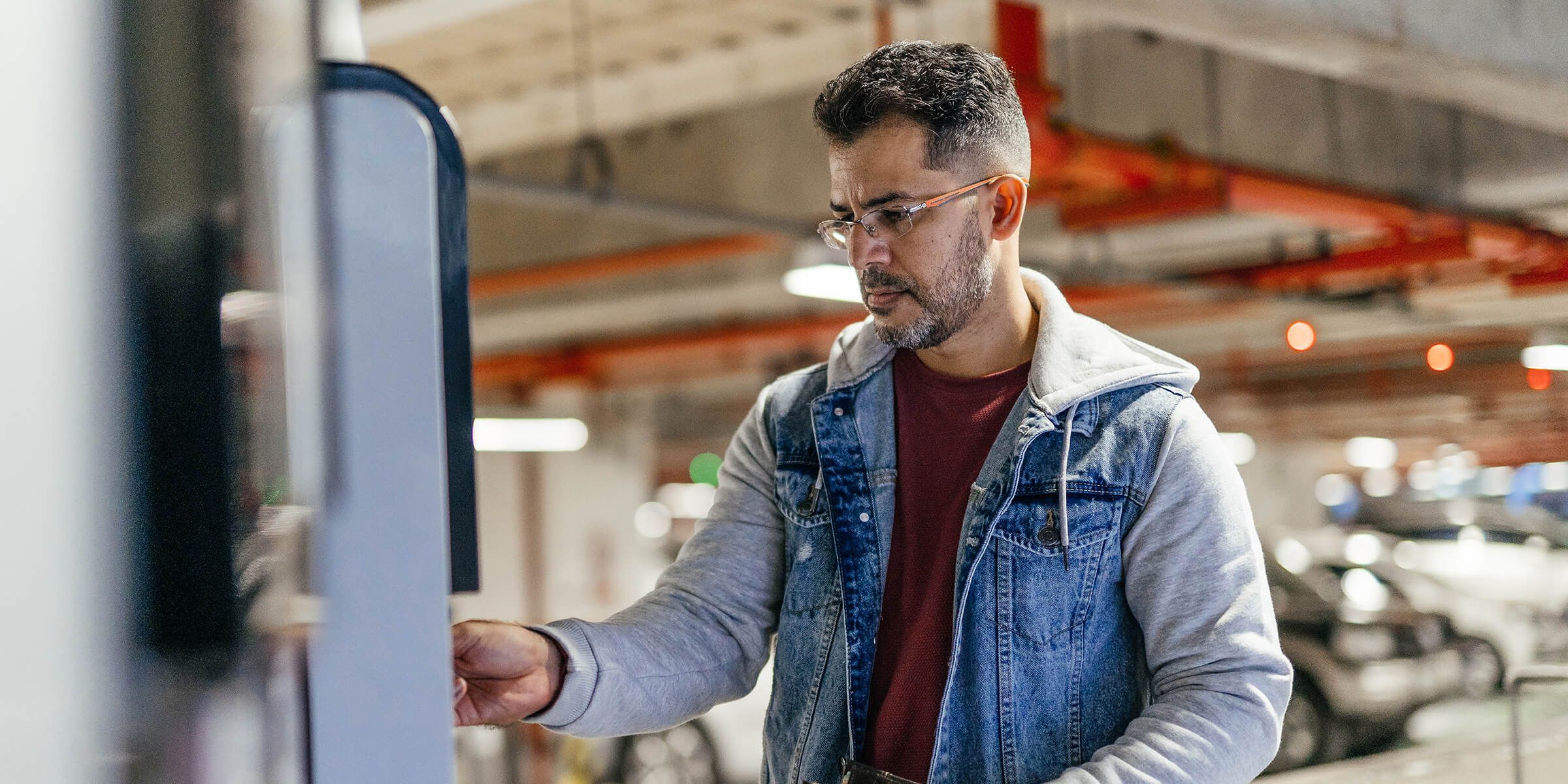 man at touchless kiosk