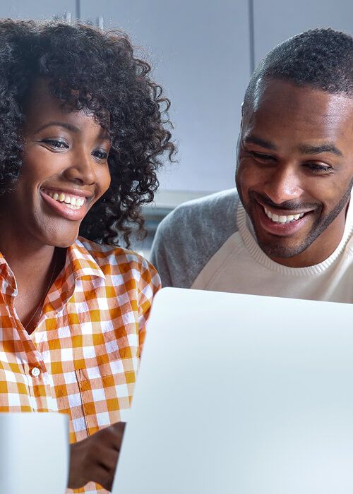 couple looking at a laptop