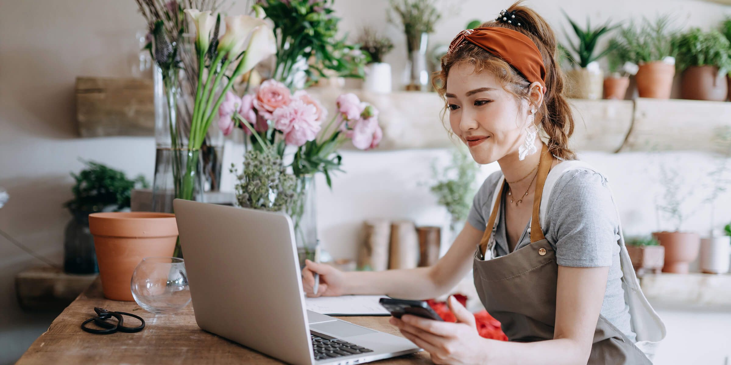 small business owner doing work on laptop