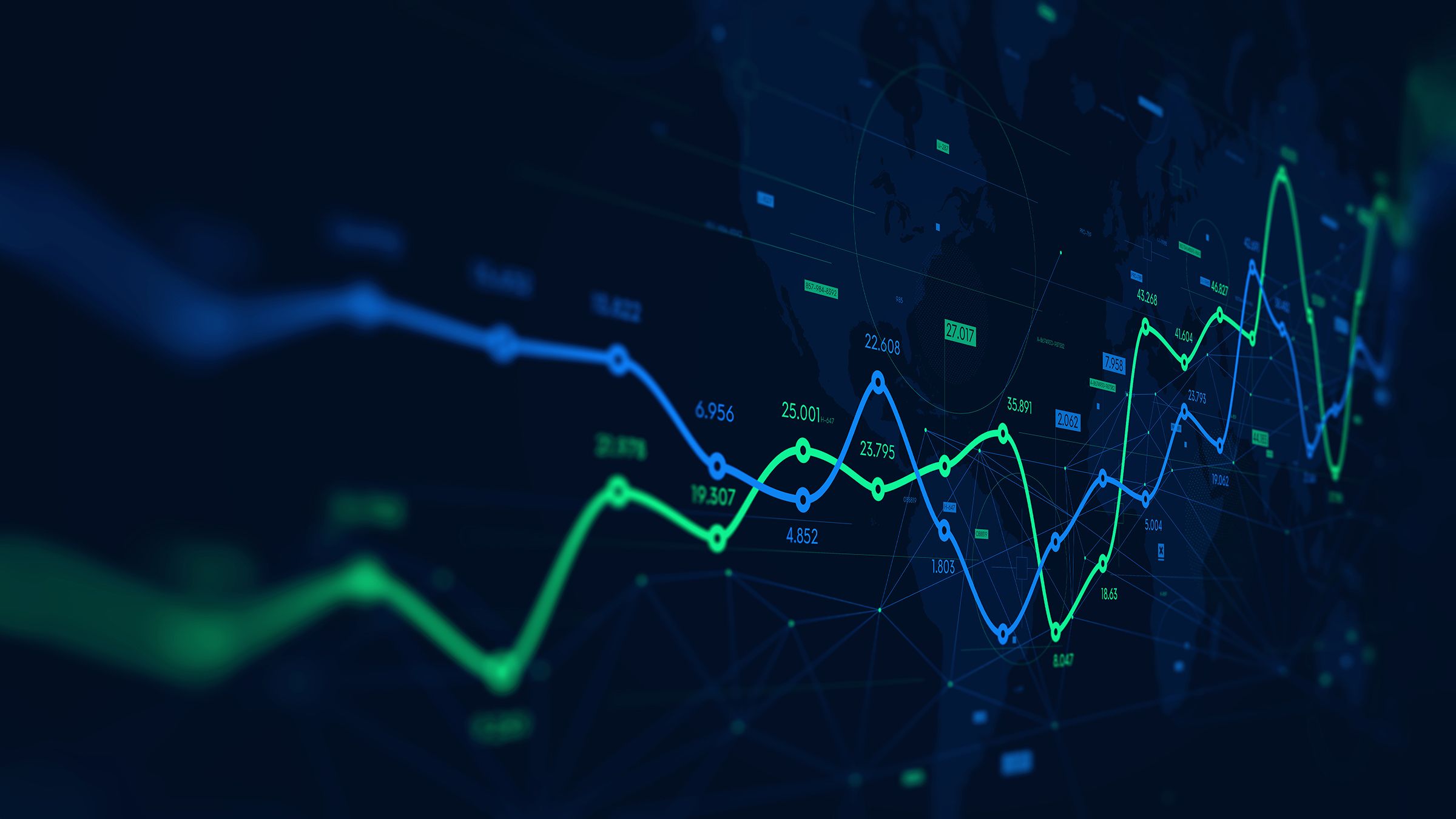 digital chart with blue and green lines going across black screen