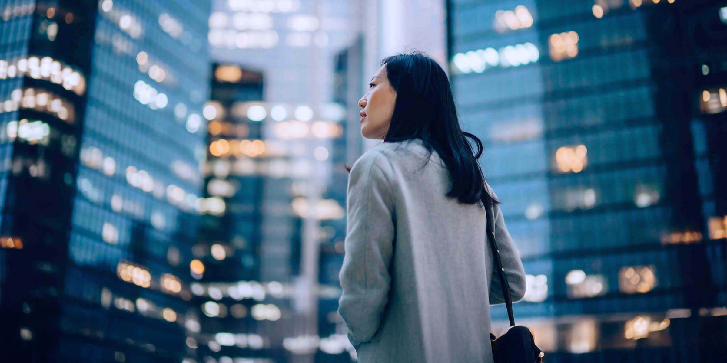 executive woman walking through the city