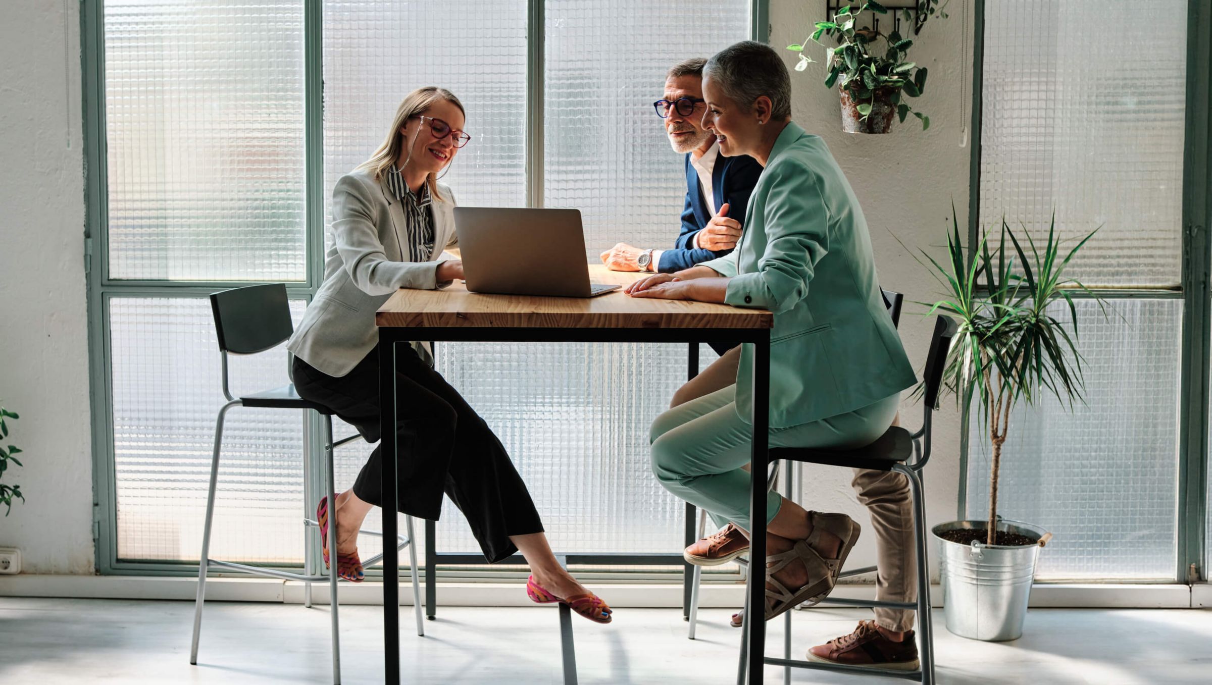 A financial advisor meeting with clients.