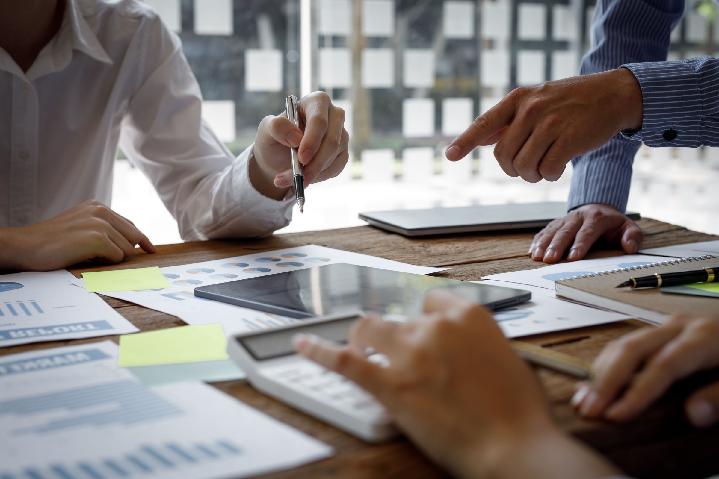People working together at a desk.