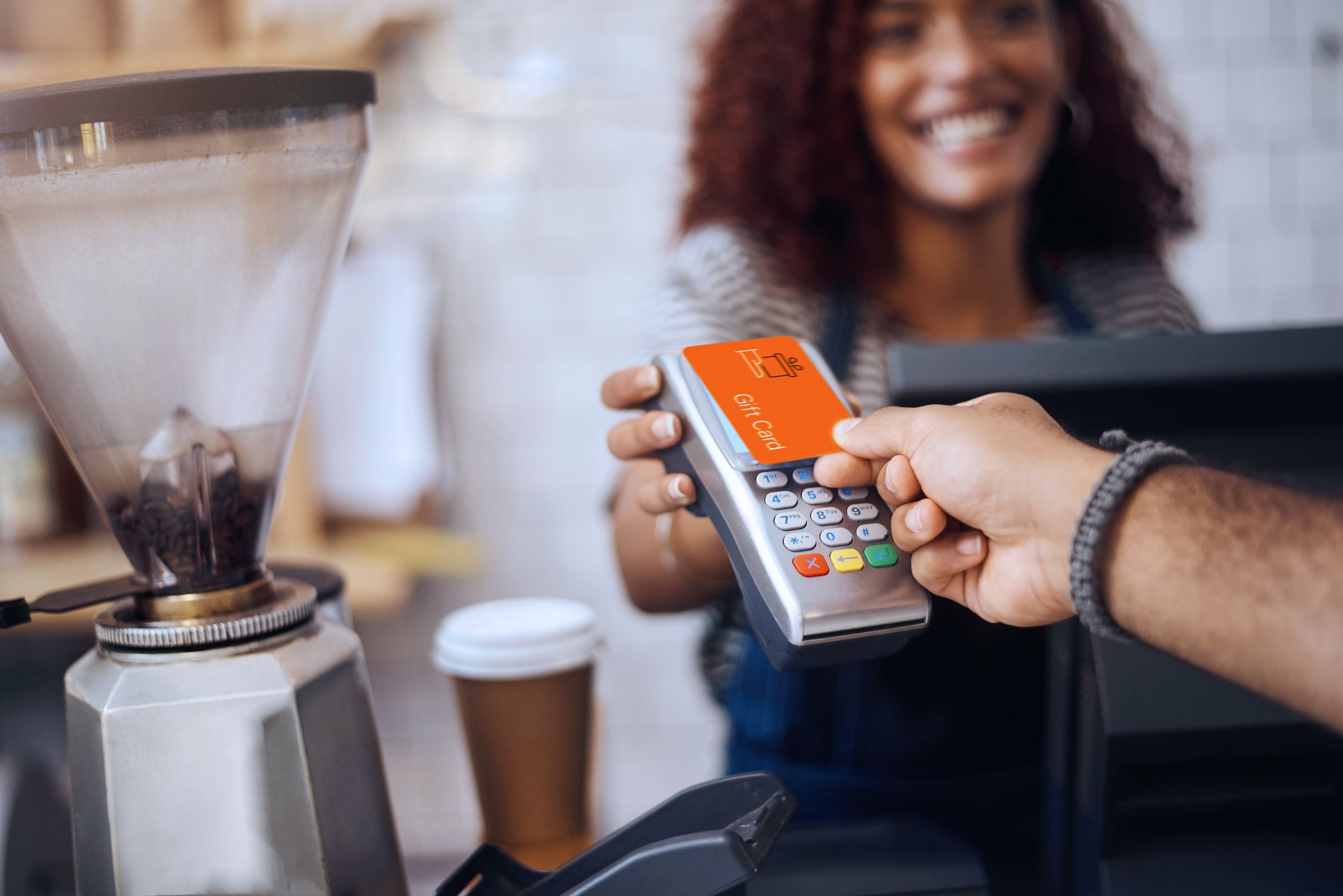 Credit card tap to pay at coffee shop