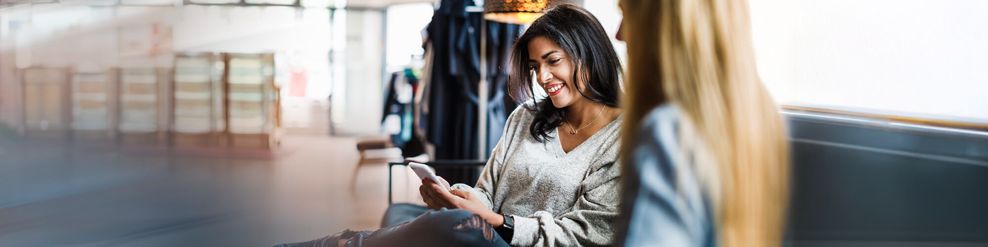 lady smiling while using her phone