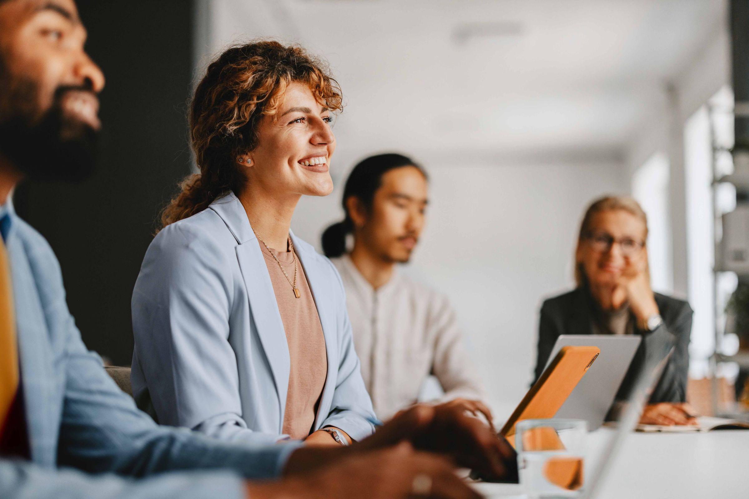 business people smiling during a meeting