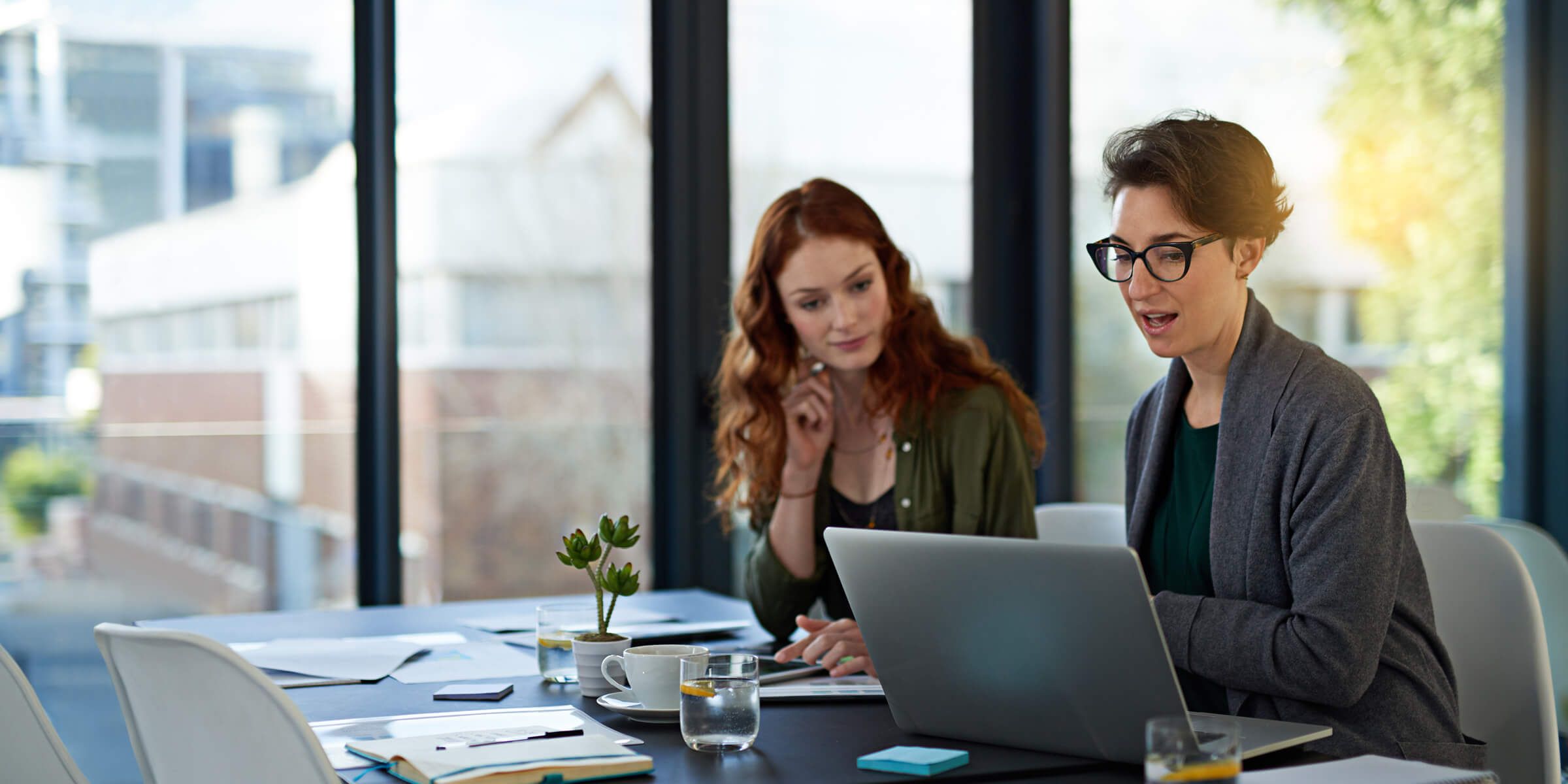 People working together at a desk.