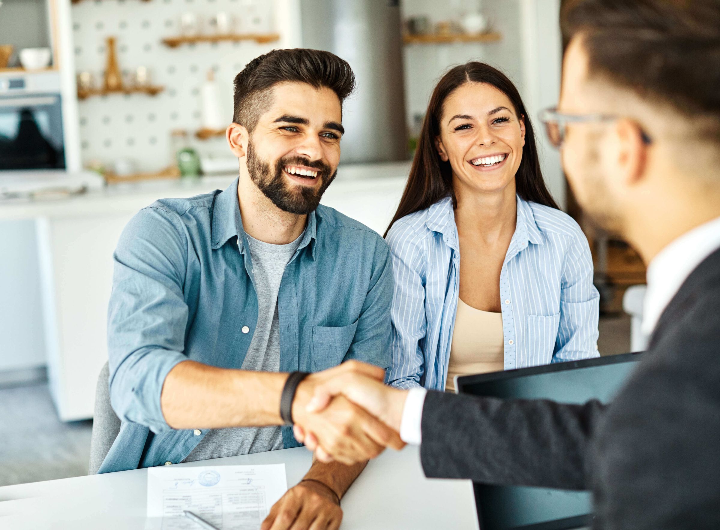 young couple shaking hands