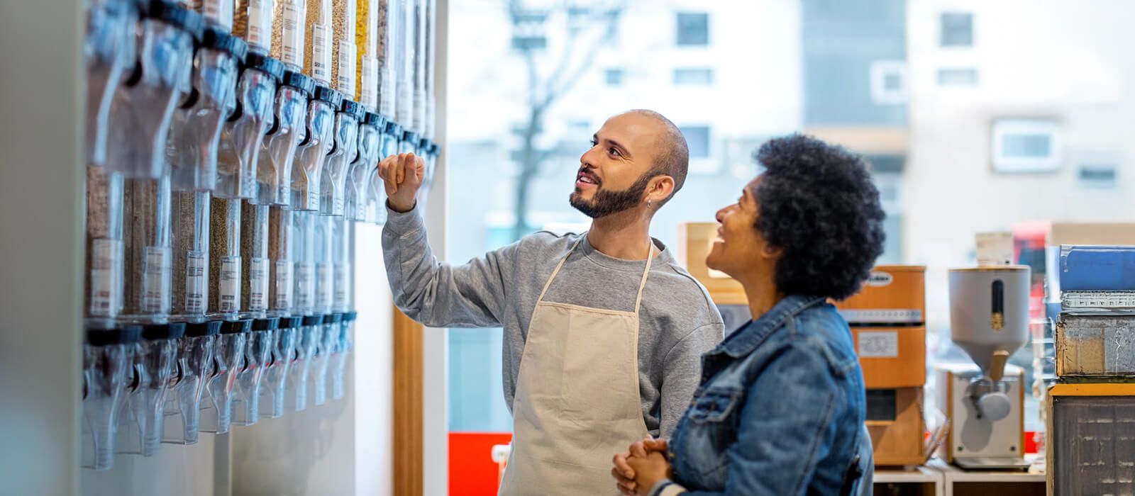 Shopkeeper assisting a customer