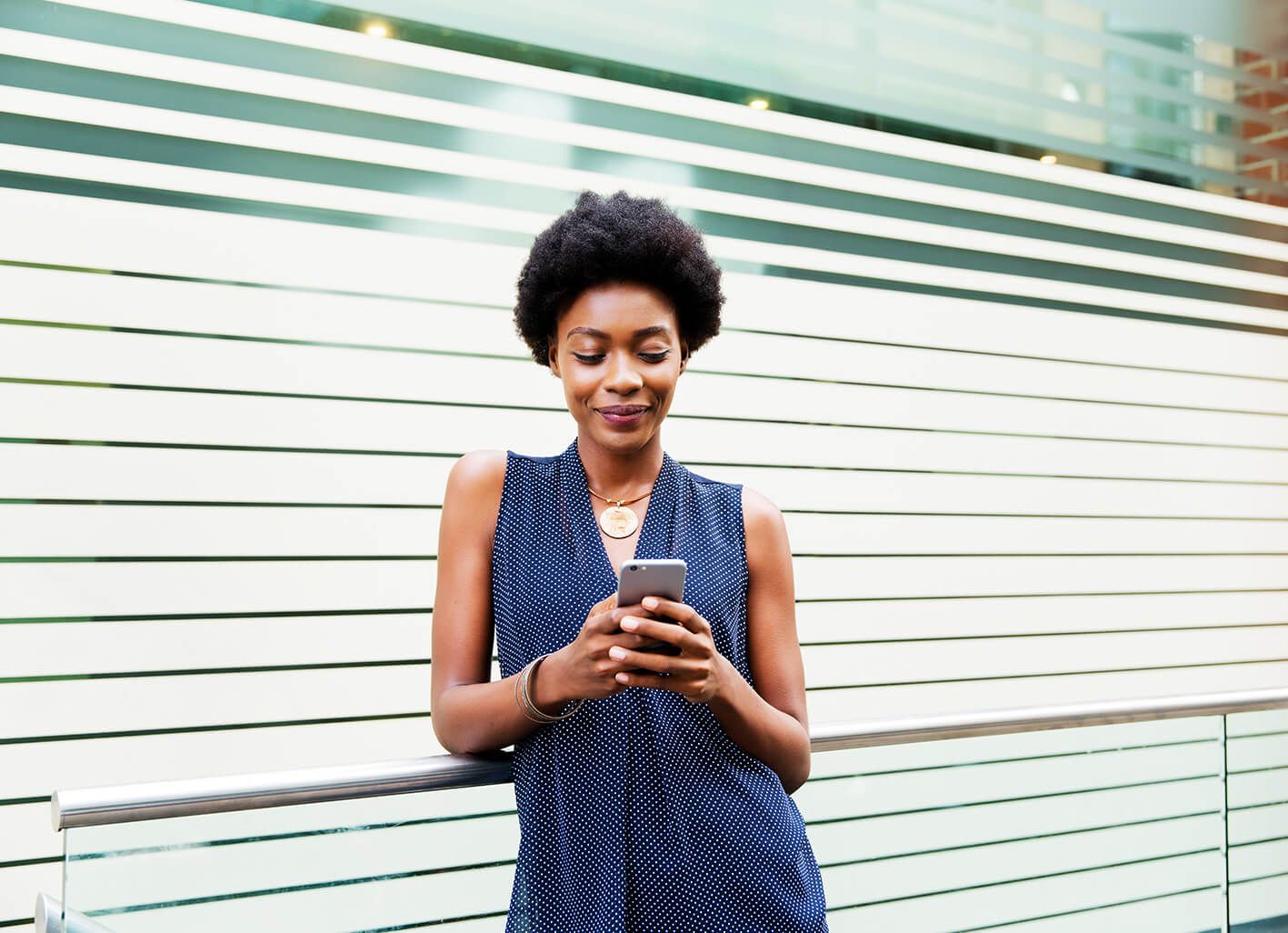 Women typing on mobile device