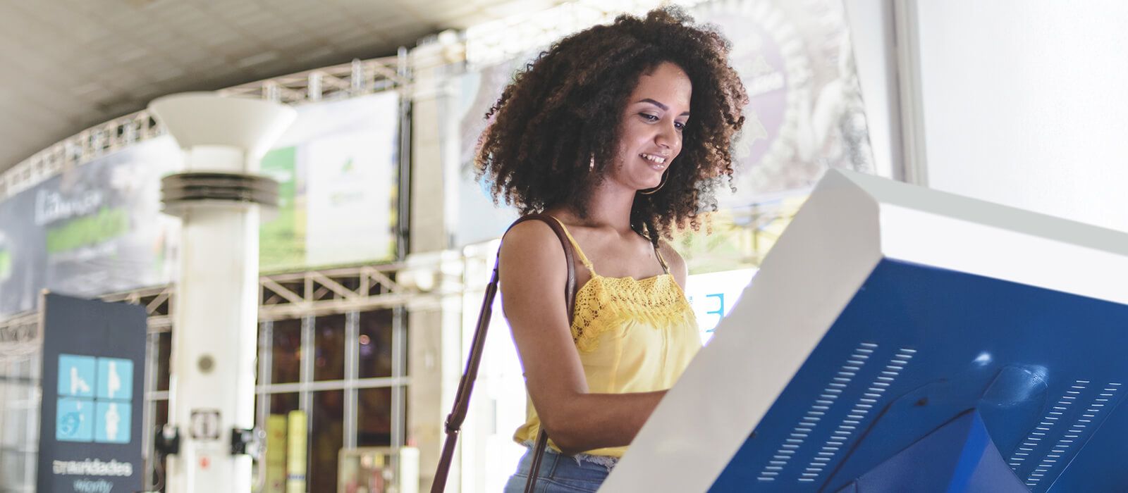 Woman at ATM future of branch experience