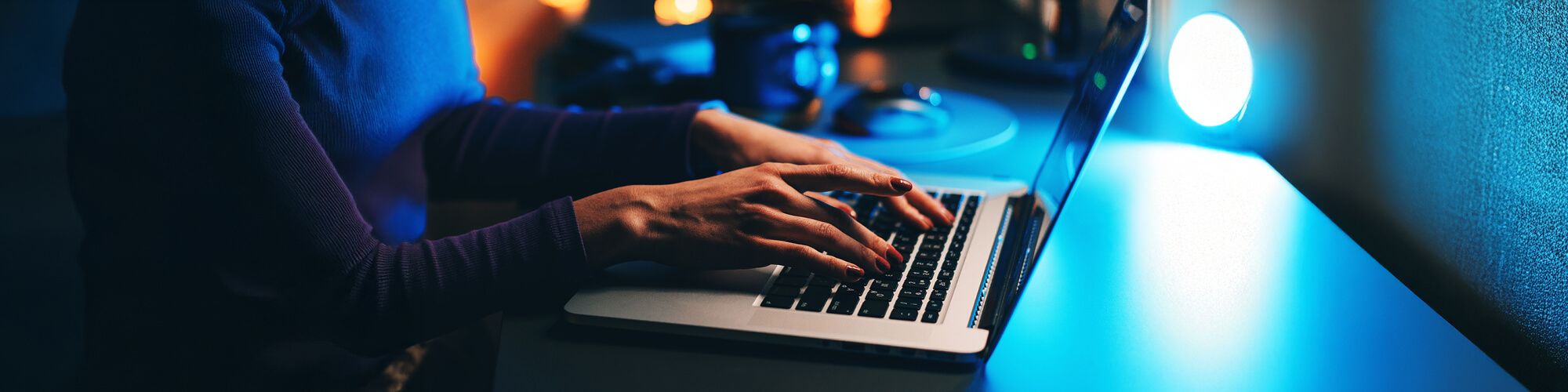 woman typing on a laptop