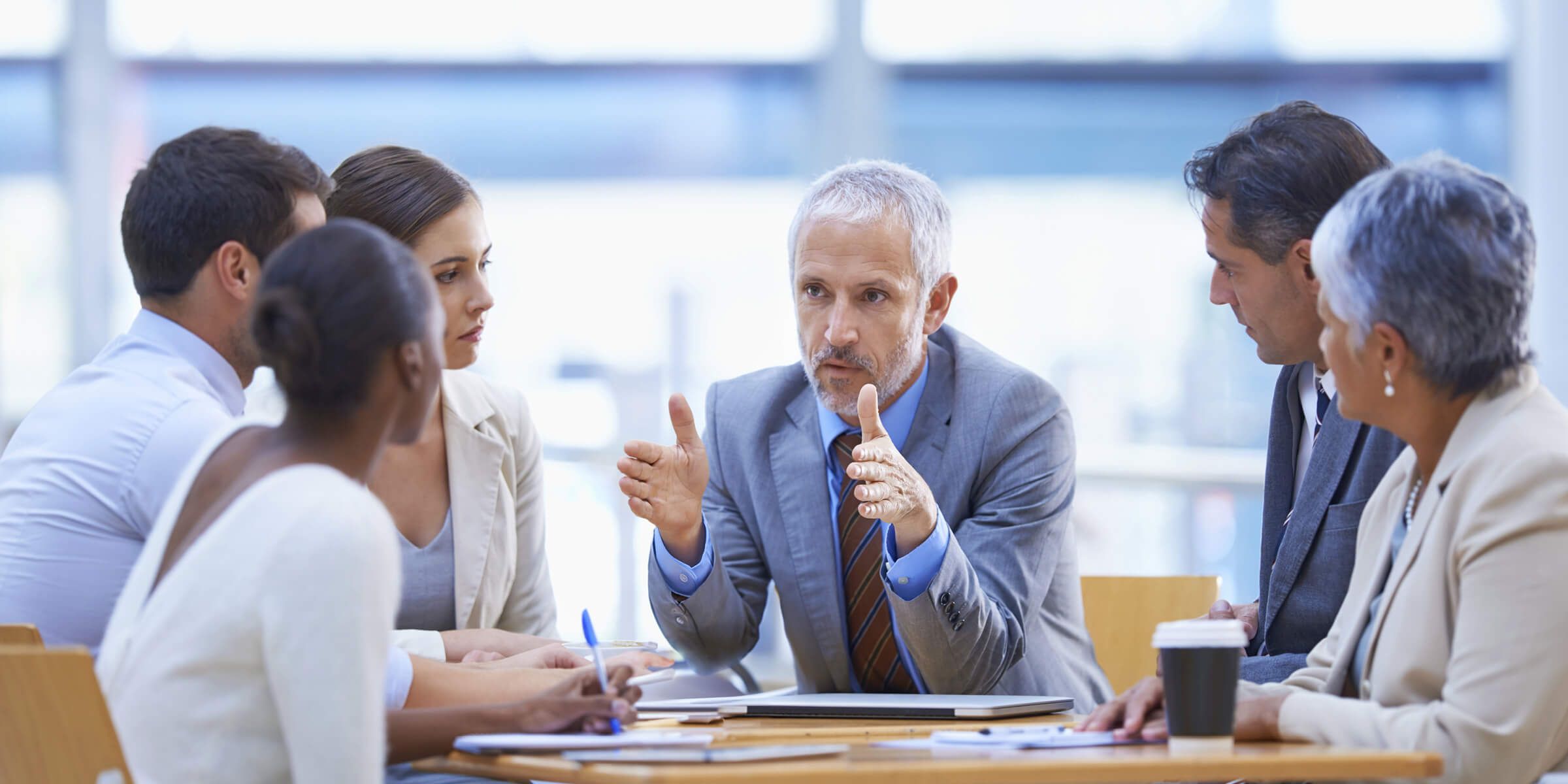 Businesspeople sitting at a table and talking