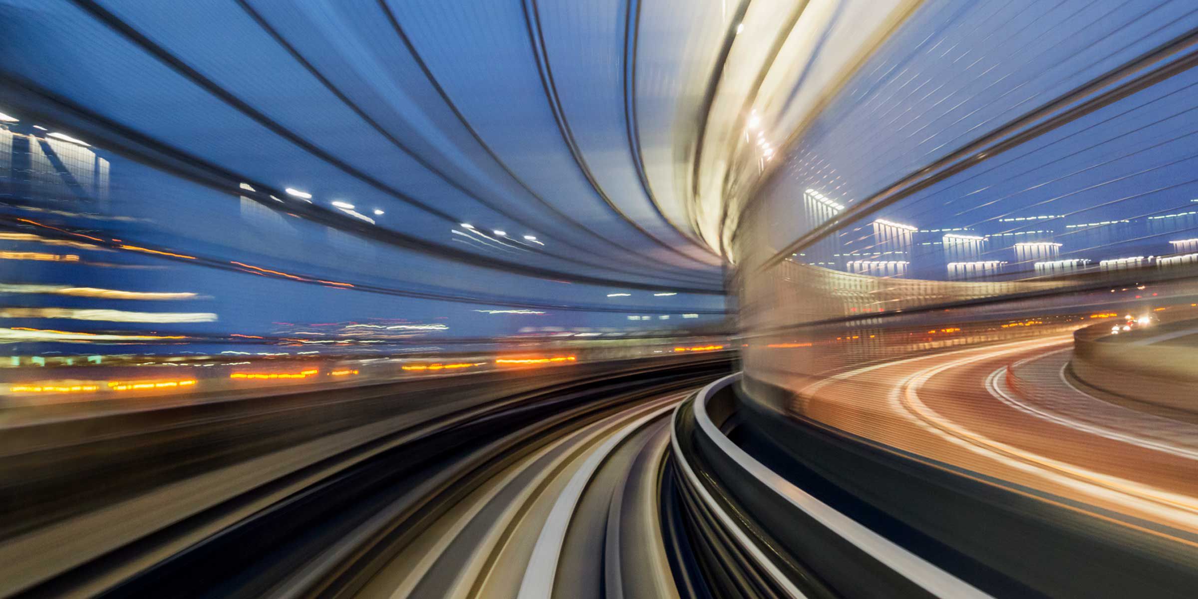 a blurry photo of a train going through a tunnel