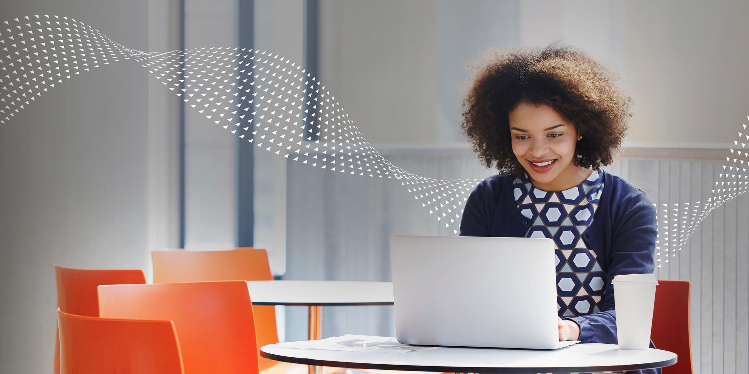 woman smiling looking at laptop